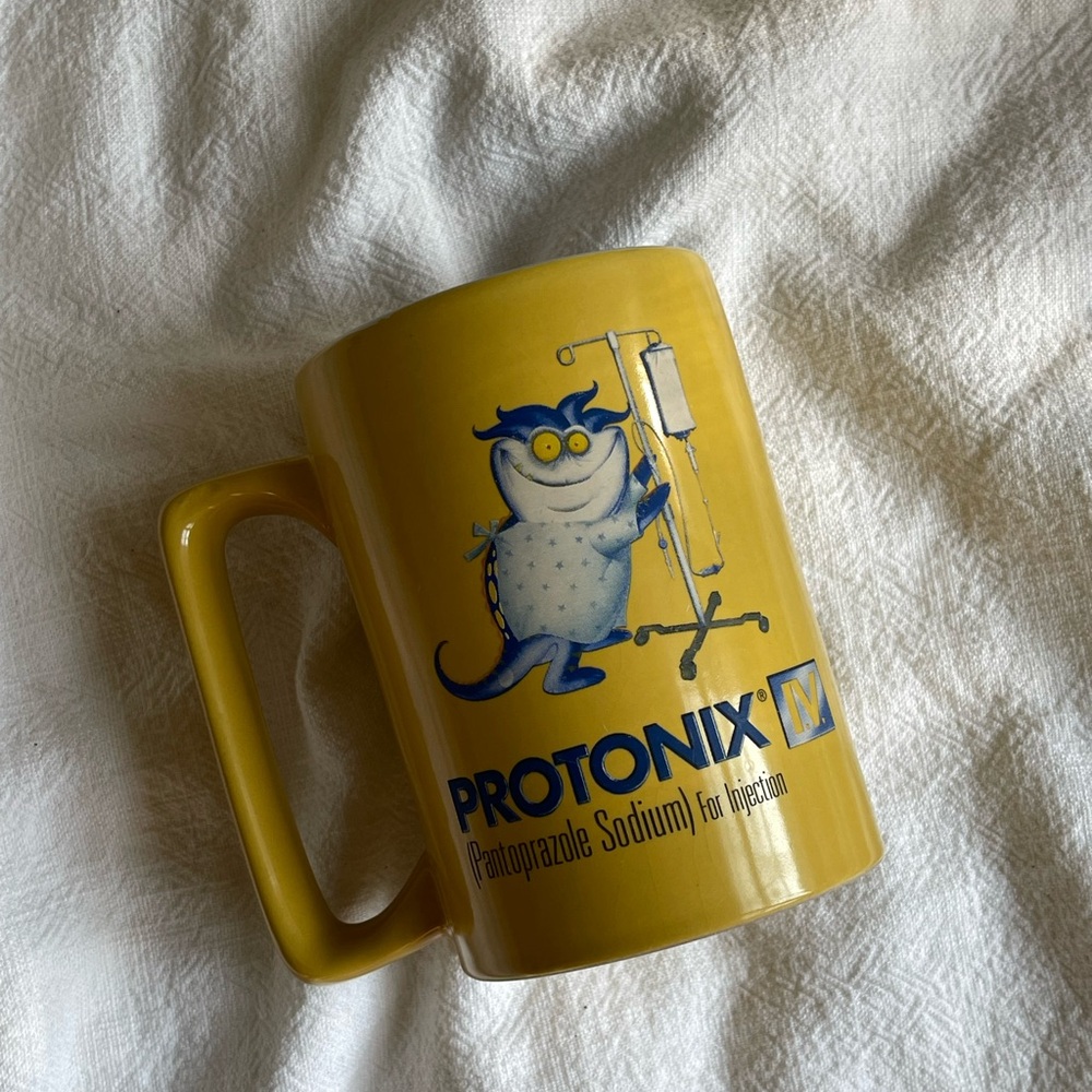 Yellow Protonix Mug with Cartoon Design